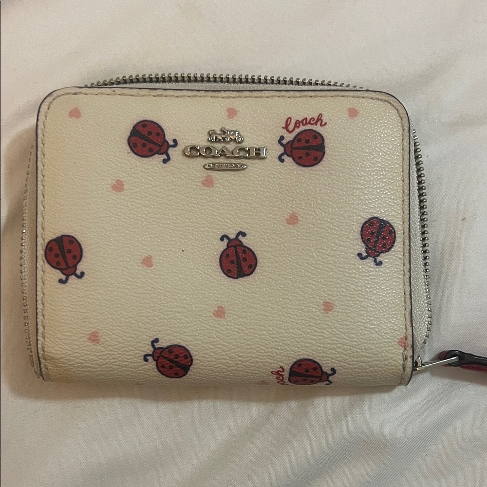 Coach Cream Wallet with Red Ladybug Design